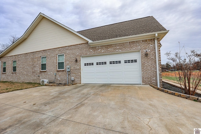 view of side of property featuring a garage