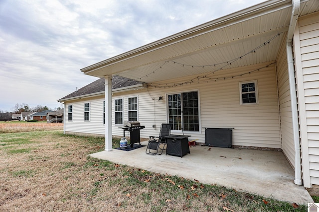 rear view of property featuring a patio area