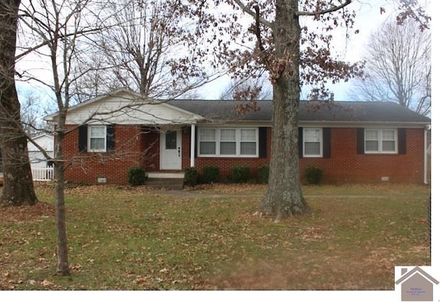 ranch-style home with a front lawn