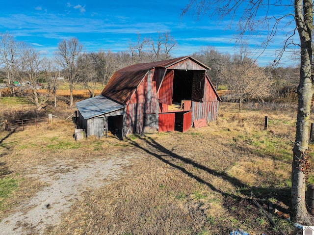 view of outdoor structure with a rural view