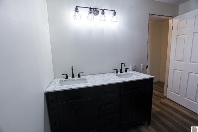 bathroom featuring hardwood / wood-style floors and vanity