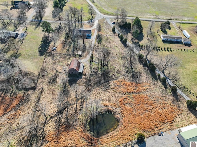 birds eye view of property featuring a rural view