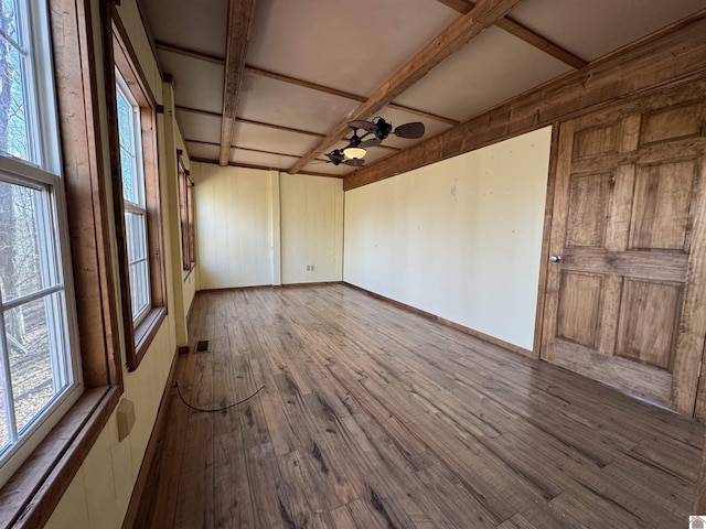 unfurnished room featuring a healthy amount of sunlight, ceiling fan, wood-type flooring, and coffered ceiling