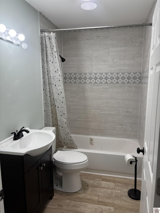 full bathroom featuring shower / bath combination with curtain, toilet, vanity, and wood-type flooring