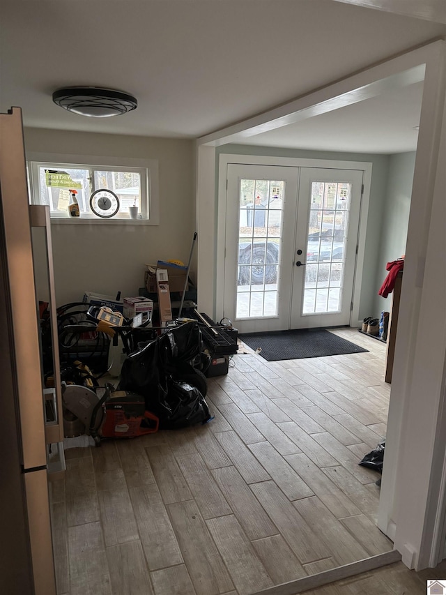 interior space featuring light hardwood / wood-style floors and french doors