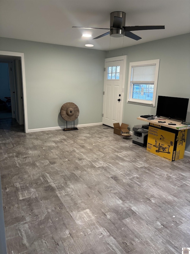 entrance foyer with hardwood / wood-style flooring and ceiling fan