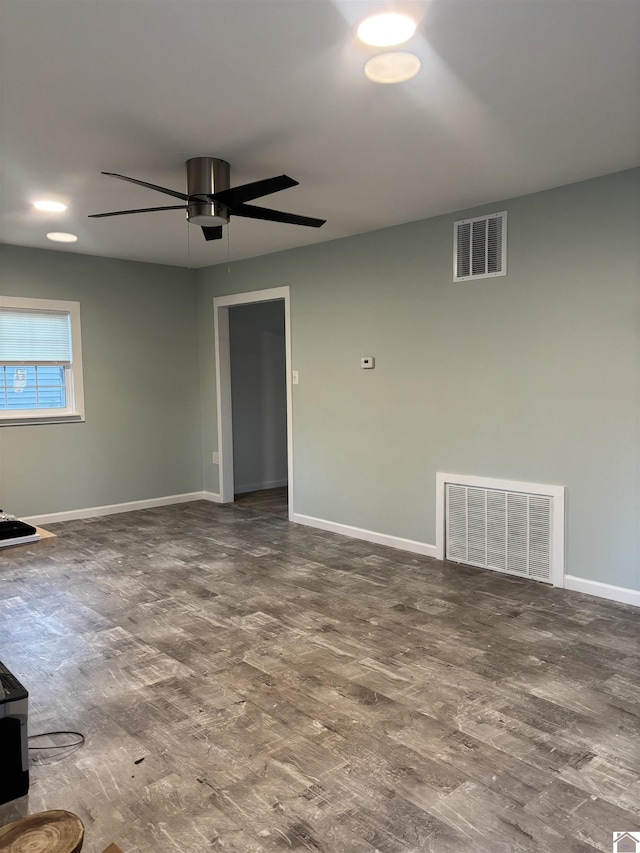 unfurnished room with ceiling fan and hardwood / wood-style flooring