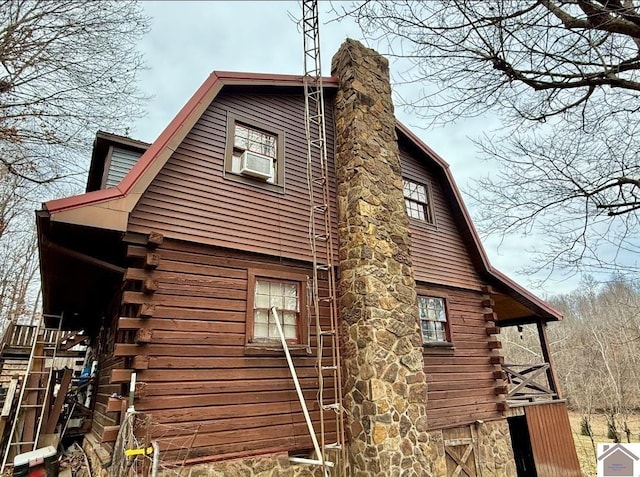 view of side of home with cooling unit