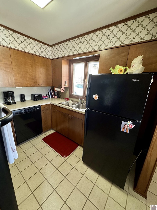 kitchen with light tile patterned floors, sink, and black appliances