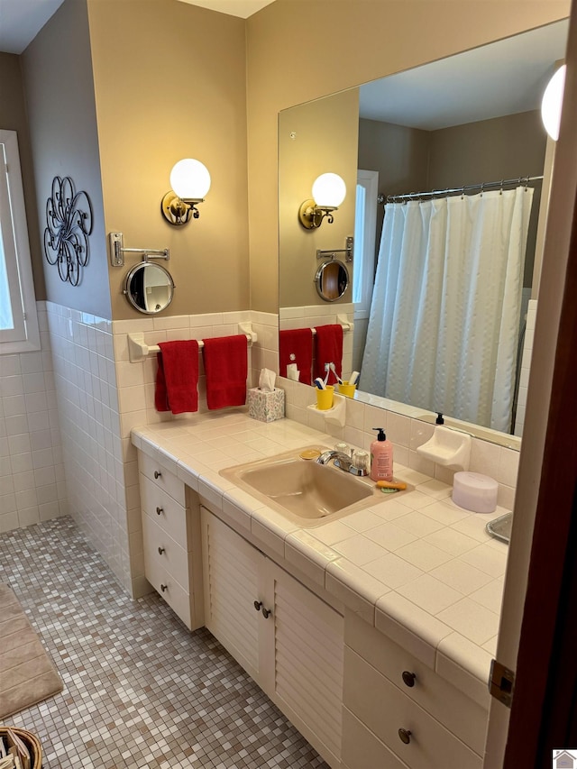 bathroom with tile patterned floors, vanity, and a shower with curtain