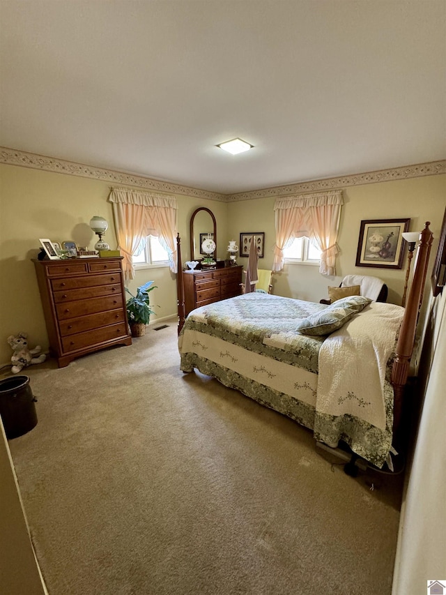 bedroom featuring carpet and multiple windows