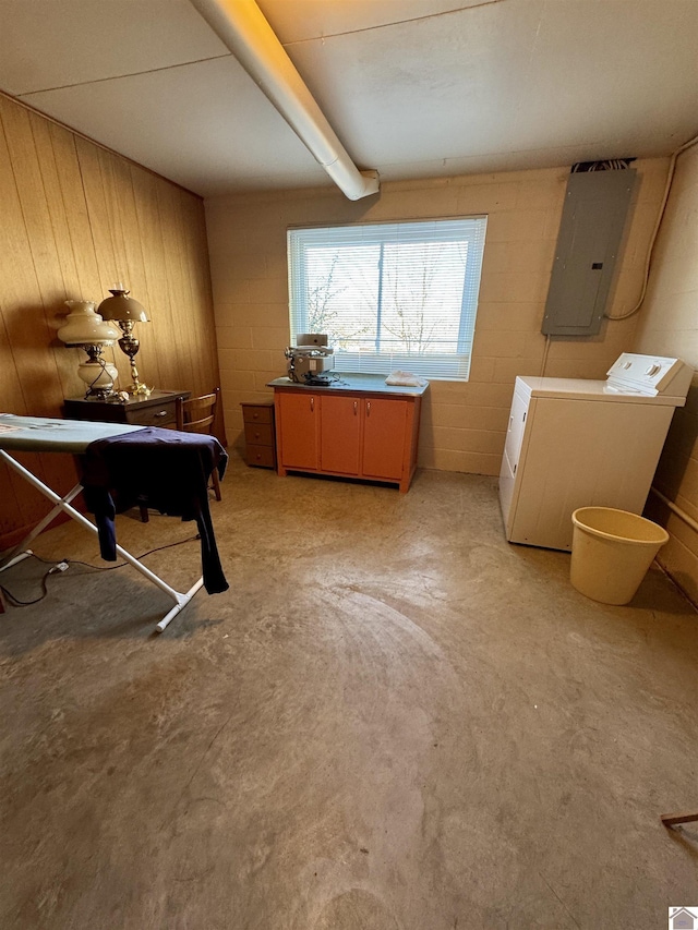 miscellaneous room with electric panel and washing machine and clothes dryer