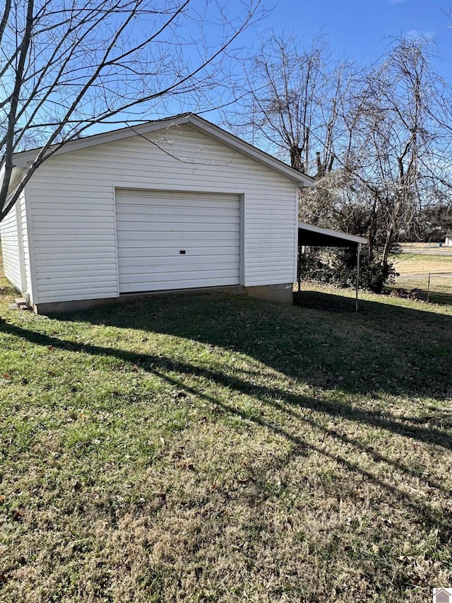 garage featuring a yard