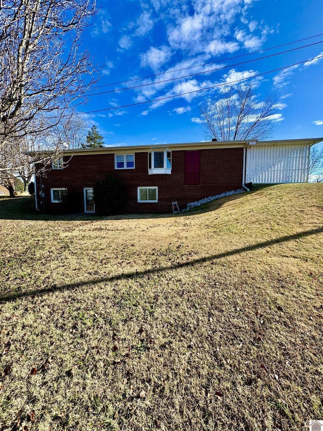 view of property exterior featuring a lawn