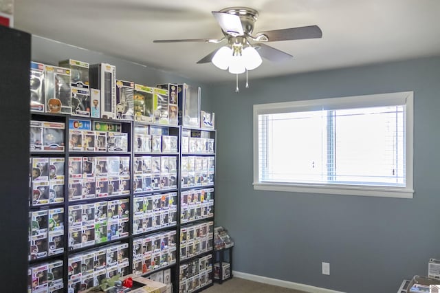 playroom featuring carpet and ceiling fan