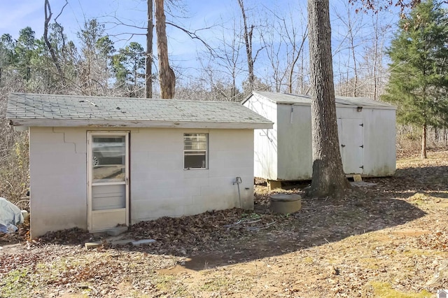 exterior space with a storage shed