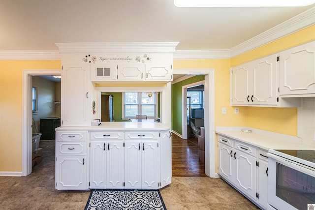 kitchen featuring white range, white cabinetry, and crown molding