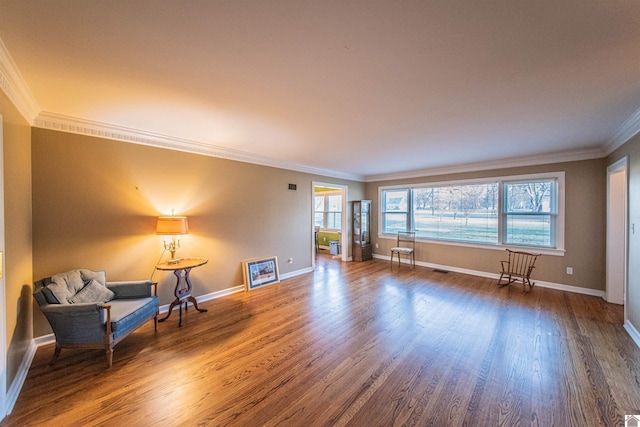 interior space featuring hardwood / wood-style floors and crown molding