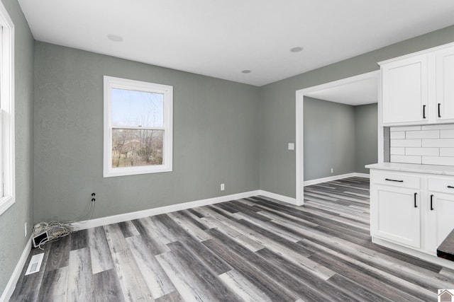 empty room with wood-type flooring