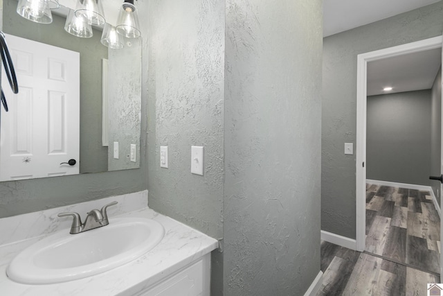 bathroom with vanity and wood-type flooring