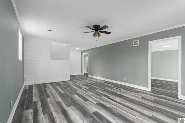 unfurnished room with ceiling fan, dark hardwood / wood-style flooring, and ornamental molding