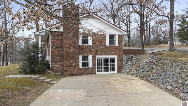 view of home's exterior with french doors