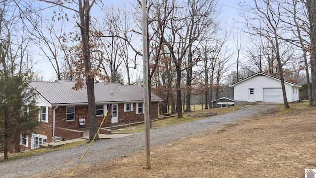 view of home's exterior with a garage and an outdoor structure