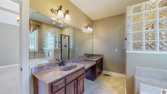 bathroom featuring vanity, tile patterned flooring, and plus walk in shower