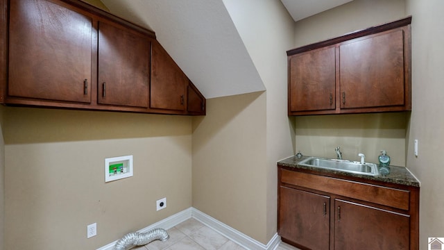 clothes washing area featuring hookup for a washing machine, sink, cabinets, and hookup for an electric dryer