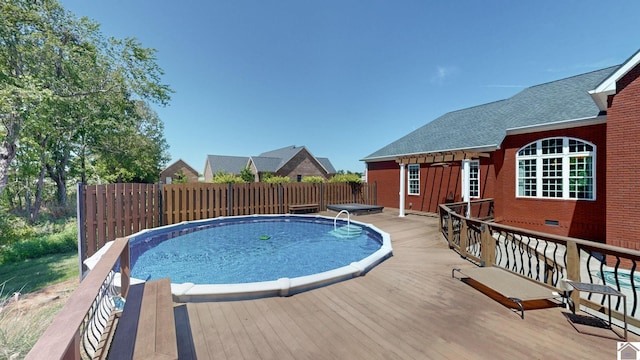 view of pool with a deck