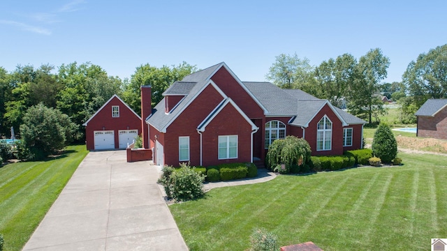 view of front of home with a garage and a front lawn