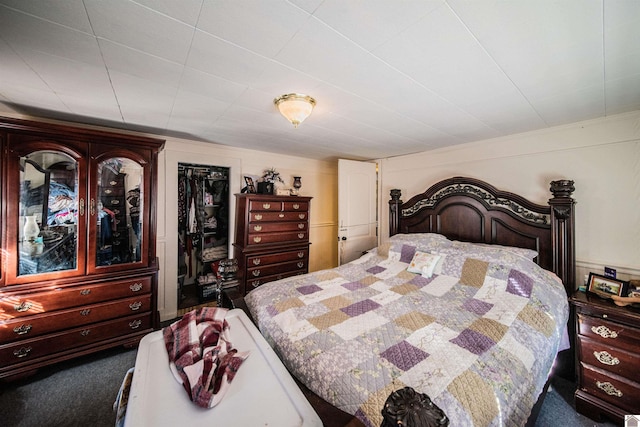 bedroom featuring a closet and dark carpet