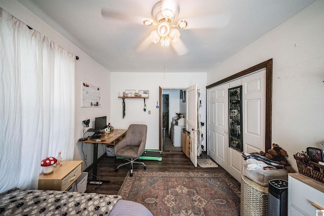 home office featuring ceiling fan and dark wood-type flooring