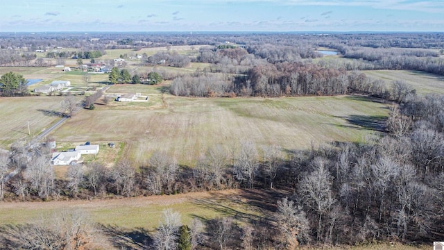 birds eye view of property with a rural view