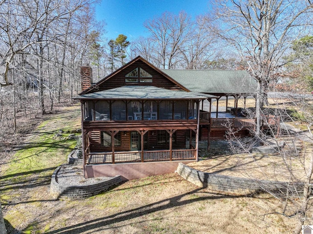 view of front of property with a sunroom