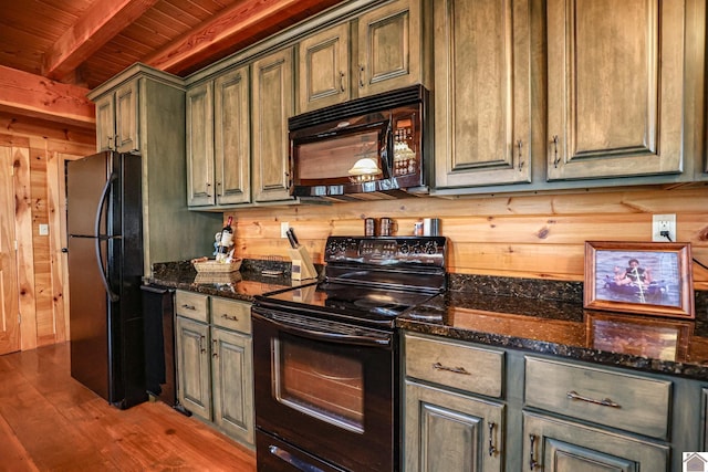 kitchen with dark stone counters, wood ceiling, black appliances, hardwood / wood-style flooring, and beamed ceiling