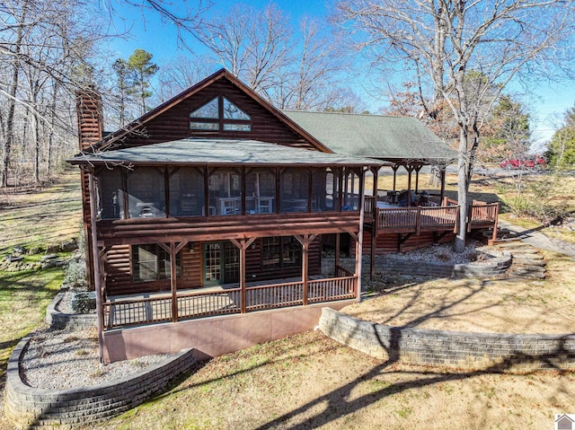 view of front of property featuring a sunroom