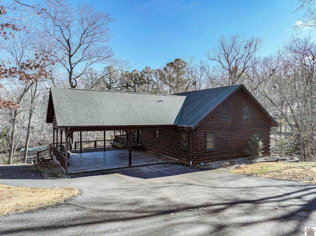 view of home's exterior with a carport