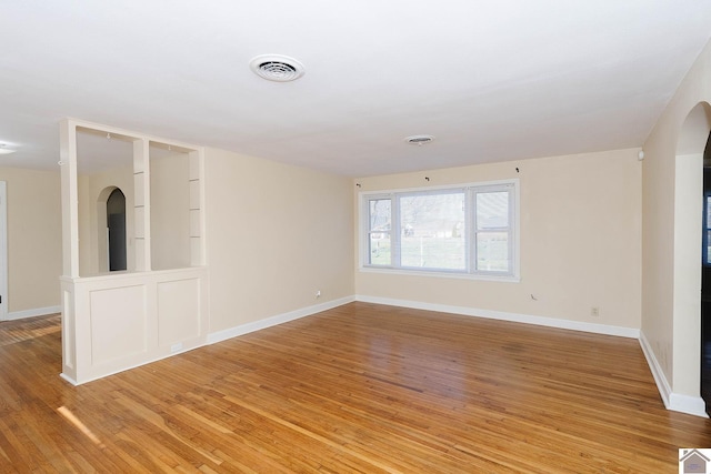 unfurnished room featuring hardwood / wood-style floors