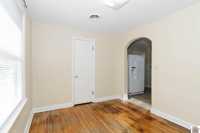 spare room featuring hardwood / wood-style floors