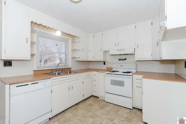 kitchen with white cabinetry, white appliances, and sink