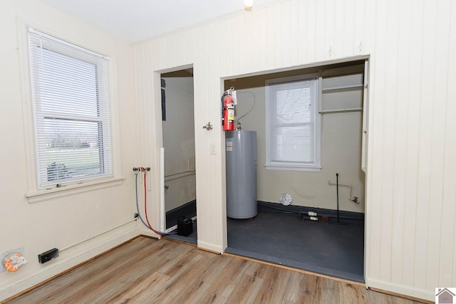 utility room featuring gas water heater