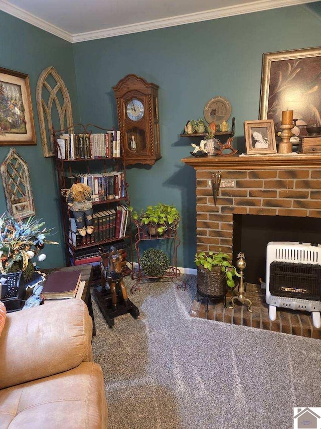 sitting room with heating unit, a brick fireplace, crown molding, and carpet flooring