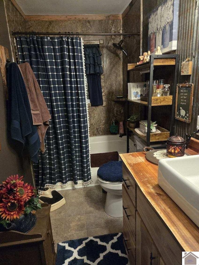 full bathroom with shower / tub combo with curtain, toilet, crown molding, vanity, and tile patterned flooring