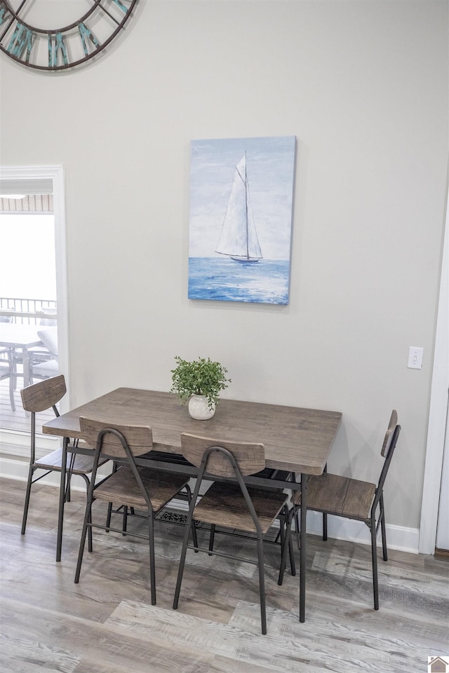 dining area featuring wood-type flooring