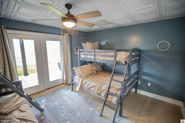 bedroom with tile patterned floors, ceiling fan, and access to outside