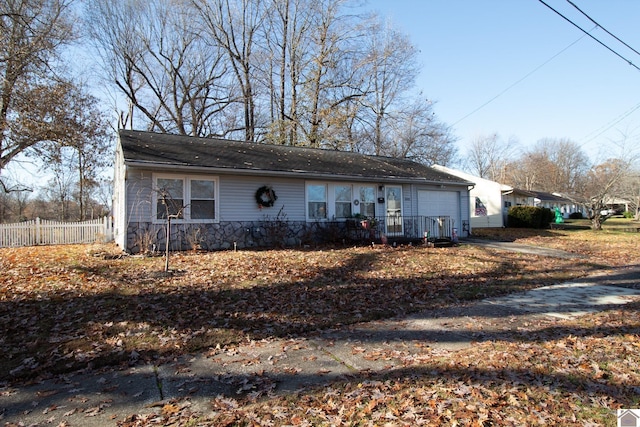 ranch-style home featuring a garage