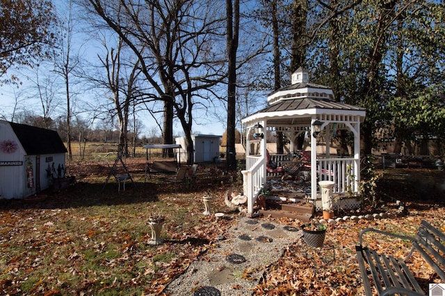 view of yard featuring a gazebo and a shed