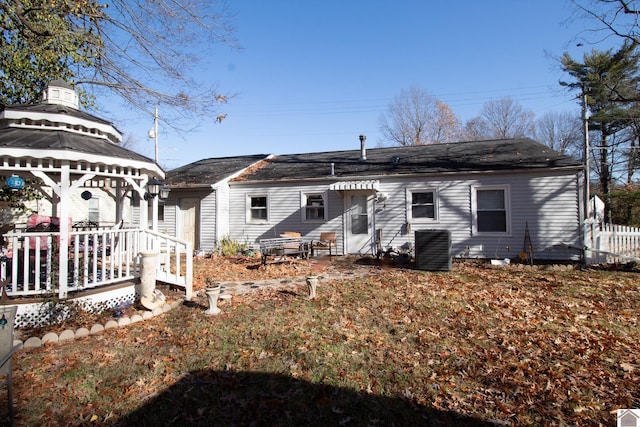 back of house featuring a gazebo and central AC unit