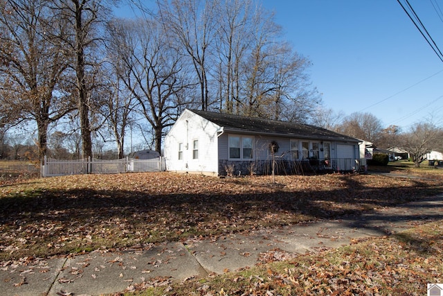 view of side of property with a garage